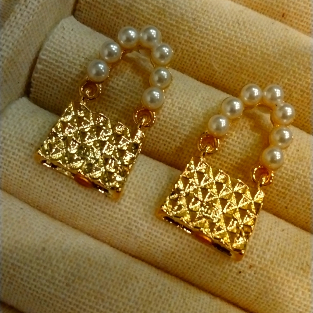 Giftable Gold hammered purse earrings with pearls. Looks like a Cha…
